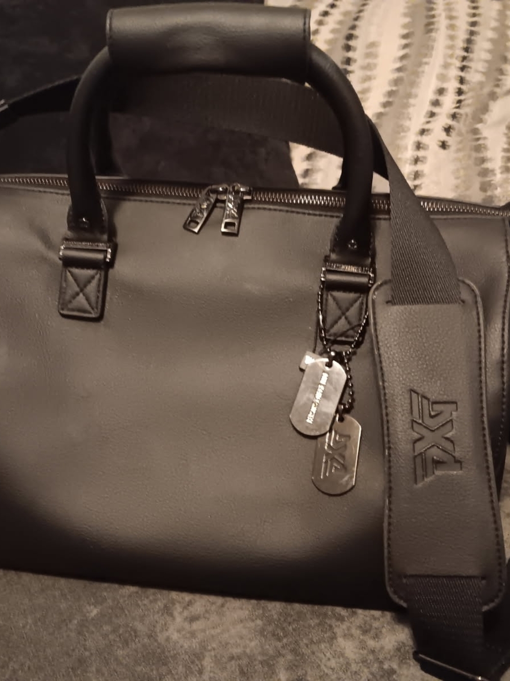 PXG Black Leather Duffel with Branded Dog-Tag Charms